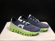 On Cloudmonster Running Shoes in Navy and Lime