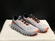 On Cloudmonster Sneakers in Foggy White and Orange