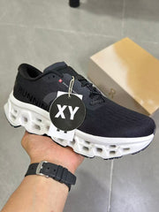 On Running Black and White Road Running Sneakers