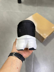 On Running Black and White Road Running Sneakers